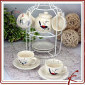 ceramic tea set with bird design and iron stander